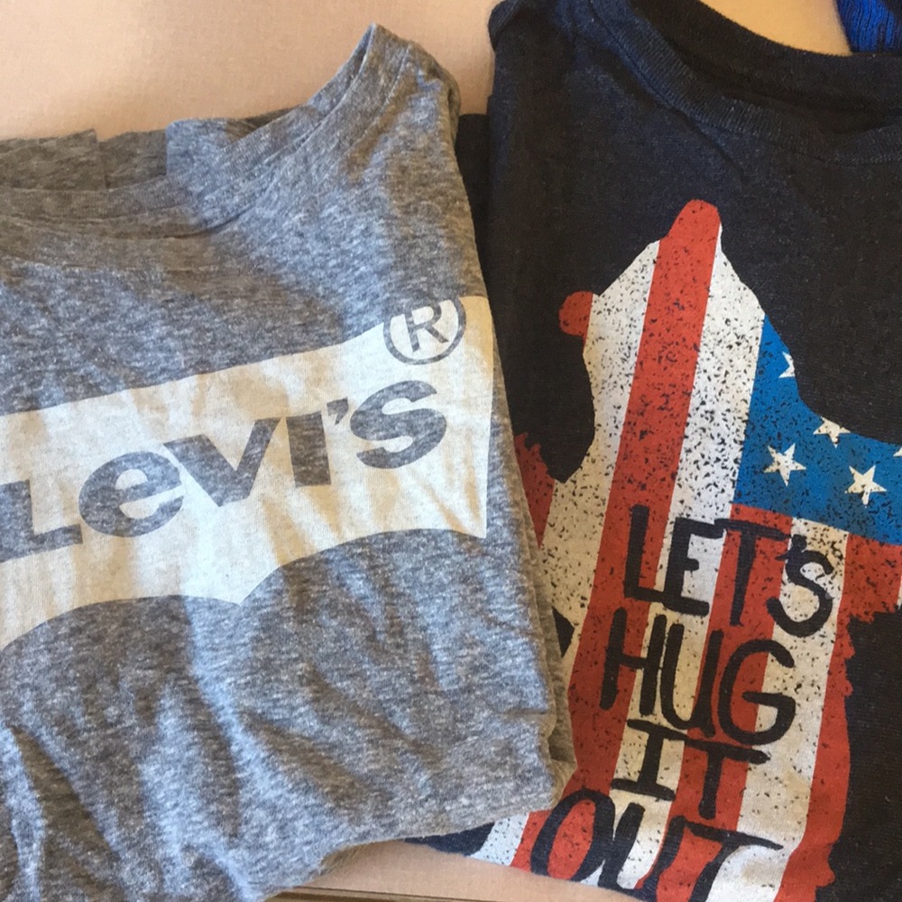 2 Boys size large short sleeved shirts